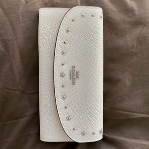 Winter white Coach wallet with silver studs